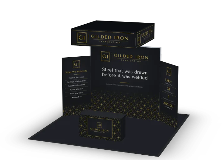 Gilded Iron Fabrication's 20 by 20 foot island exhibit in their black and gold: a fabric back wall, two angled side walls, a counter and a hanging sign.