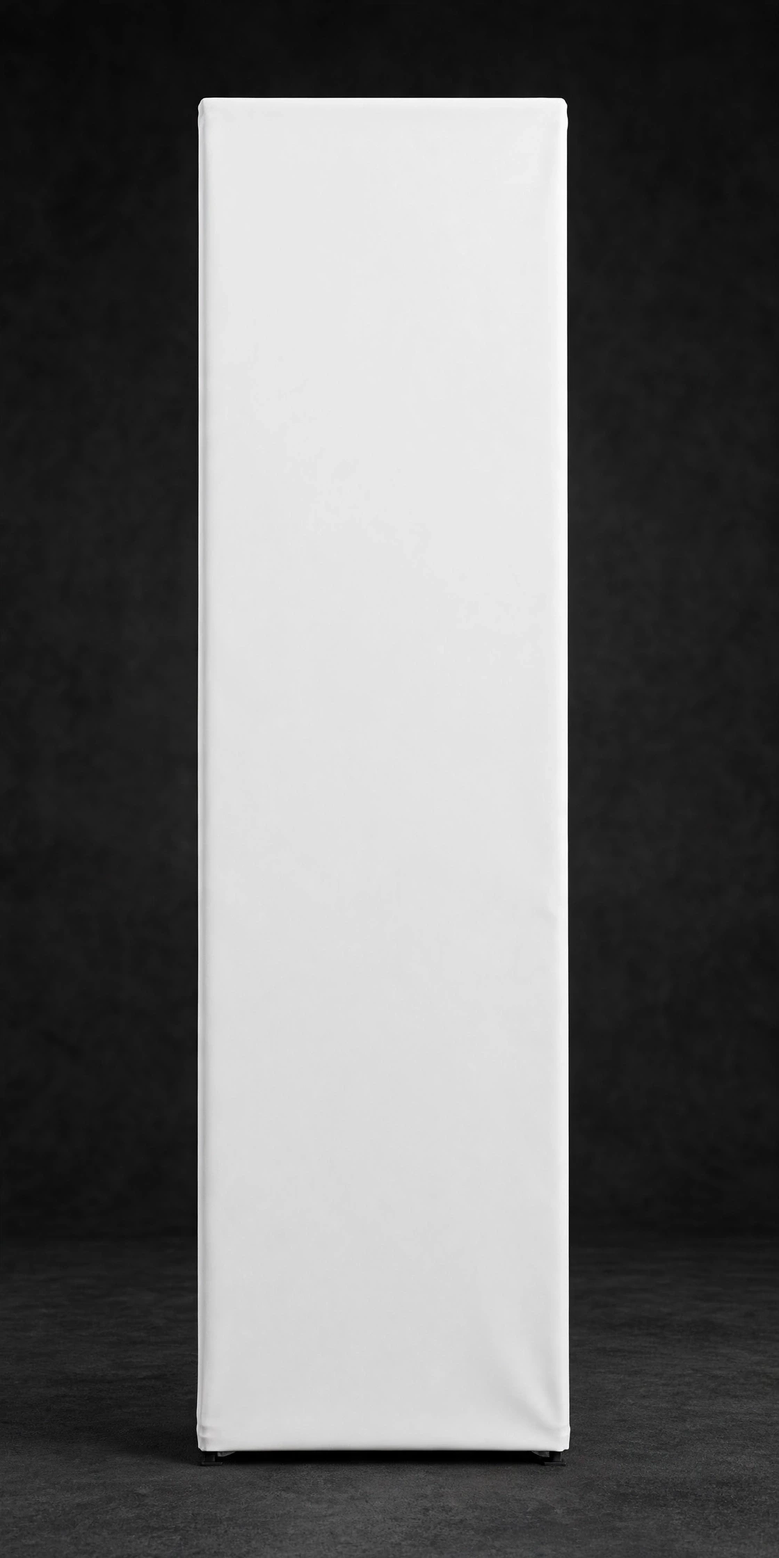 Blank white tension fabric banner tower on a dark floor