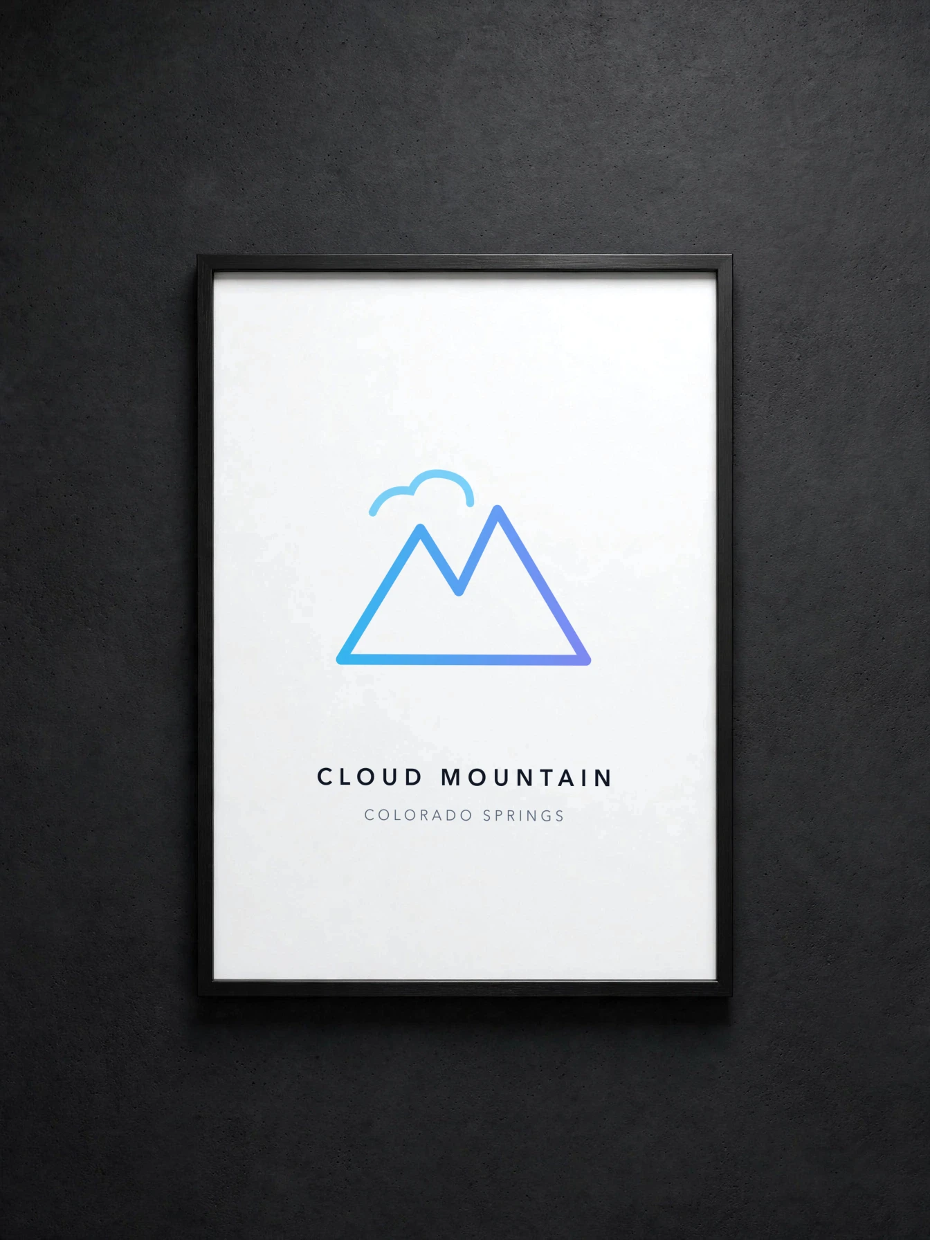 Framed print with the azure mountain mark, thin black frame on a dark wall