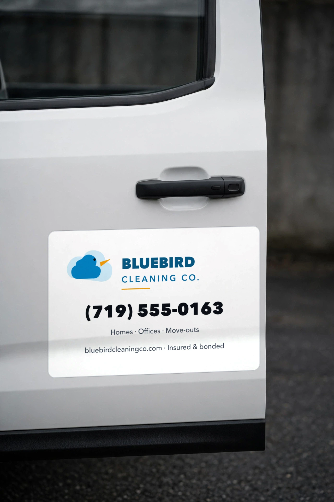 Rounded-corner magnet sign for a fictional cleaning company on a white truck door