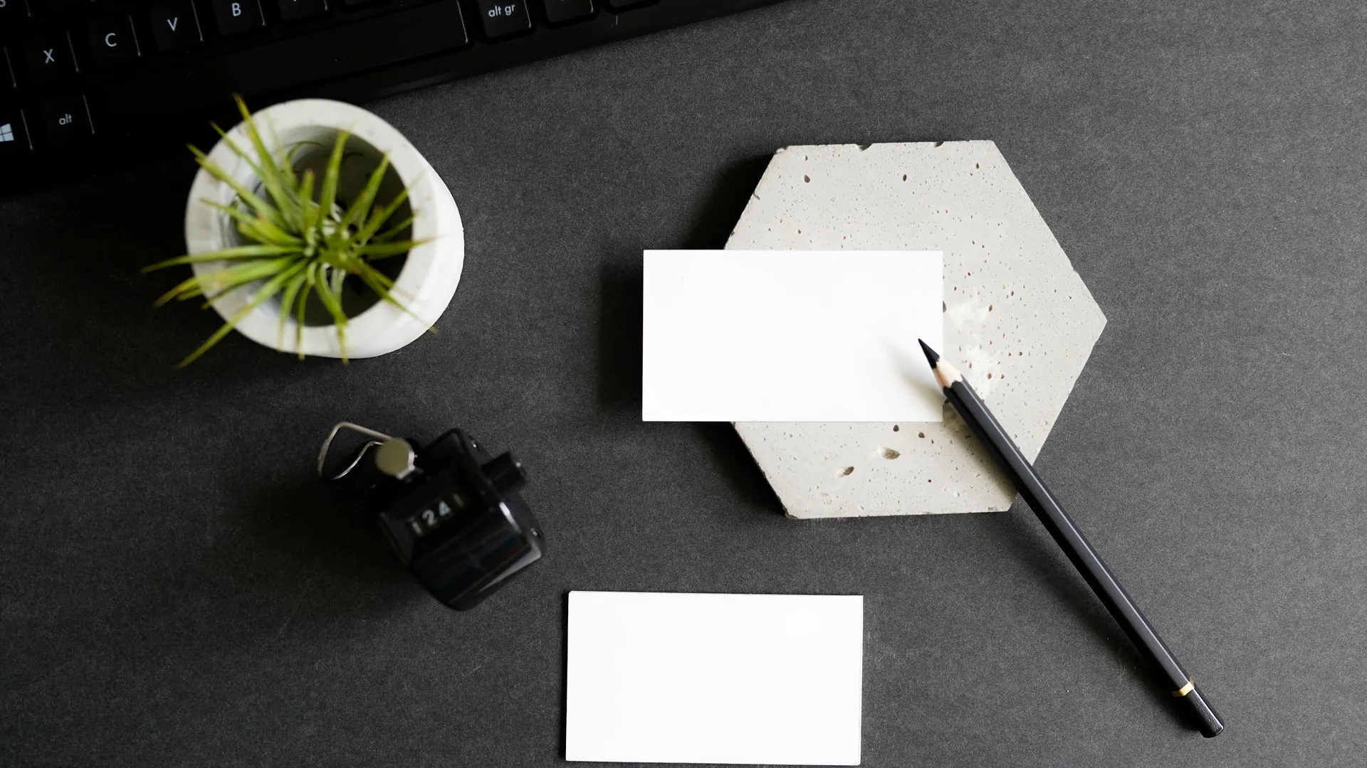 A finished brand identity laid out flat — cards, letterhead and files together