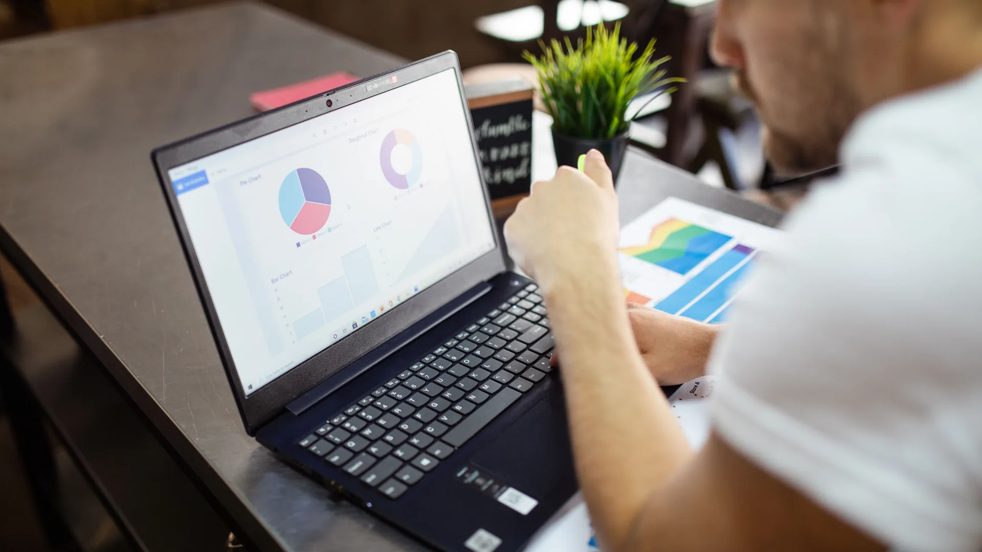 A business owner reading their dashboard on a laptop