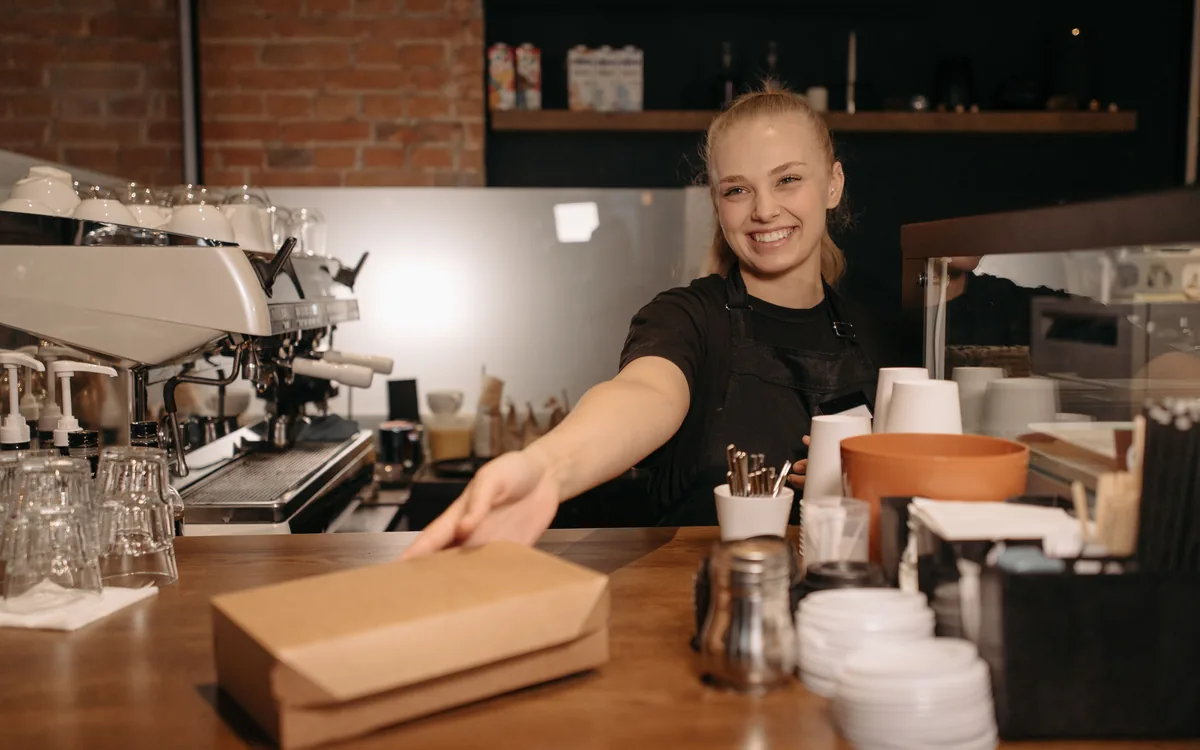 A cafe owner working behind her counter