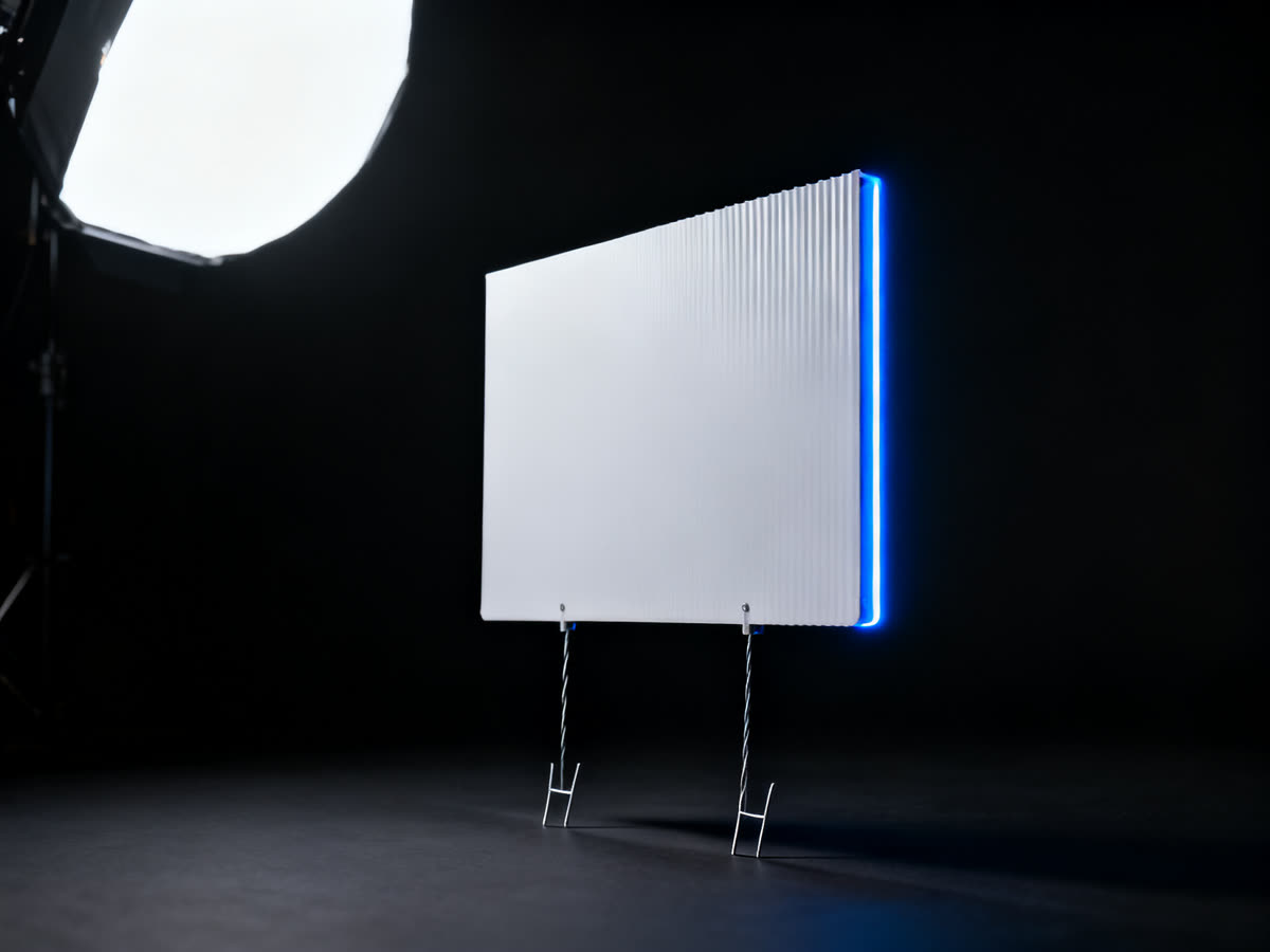 Corrugated yard sign on wire H-stakes, studio lit